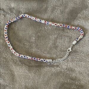 Elegant Silver Bracelet with Red and Blue Accents